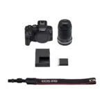 Canon EOS R10 with RF-S 18-150mm IS STM kit components including body lens charger and strap