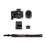 Canon EOS R10 with RF-S 18-45mm IS STM kit components including body lens charger and strap