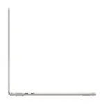 MacBook Air 13-inch M5 in Starlight, open and seen from the left side, showing the MagSafe 3 charging port and two Thunderbolt ports