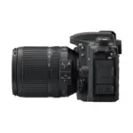 Nikon D7500 with AF-S DX NIKKOR 18-140mm f/3.5-5.6G ED VR lens, left side view with the microphone, HDMI, headphone and USB ports