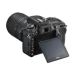 Nikon D7500 with AF-S DX NIKKOR 18-140mm f/3.5-5.6G ED VR lens, angled rear view with the monitor tilted out