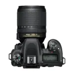 Nikon D7500 with 18-140mm VR lens, top view with control dials and LCD