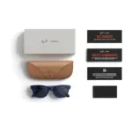 Ray-Ban Meta Wayfarer (Gen 2) smart glasses, Shiny Cosmic Blue frame with Sapphire Transitions lenses, shown with the charging case, cable and documentation supplied in the box.