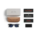 Ray-Ban Meta Wayfarer (Gen 2) smart glasses, Shiny Transparent Grey frame with Sapphire Transitions lenses, shown with the charging case, cable and documentation supplied in the box.