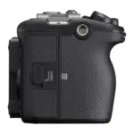 Sony FX3 camera body, side view with the memory card door and hand grip