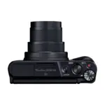 Canon PowerShot SX740 HS Lite Edition compact camera in black, top view with the zoom lens extended