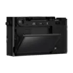 Fujifilm X-E5 mirrorless camera body in Black - side view with the touchscreen tilted.
