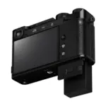 Fujifilm X-E5 mirrorless camera body in Black - rear view with the touchscreen tilted downward.