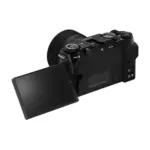 Fujifilm X-M5 mirrorless camera in Black with the XC 15-45mm lens fitted - angled view with the vari-angle screen turned out.