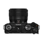 Fujifilm X-M5 mirrorless camera in Black with the XC 15-45mm lens fitted - top view showing the dials and the fitted lens.