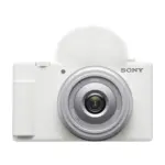Sony ZV-1F vlog camera in white, front view with the ZEISS Tessar T* lens